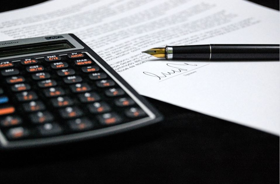 paperwork sign and calculator